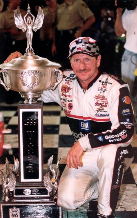 Dale Earnhardt poses with the Bristol Cup Series trophy after winning the 1999 Night Race, his final victory at the iconic short track.