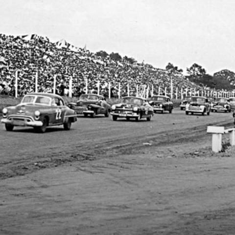NASCAR held its first official race in June 1949 at the now-defunct Charlotte Speedway, a 3/8-mile dirt track near the Charlotte airport.  Photo from NASCAR archives. 