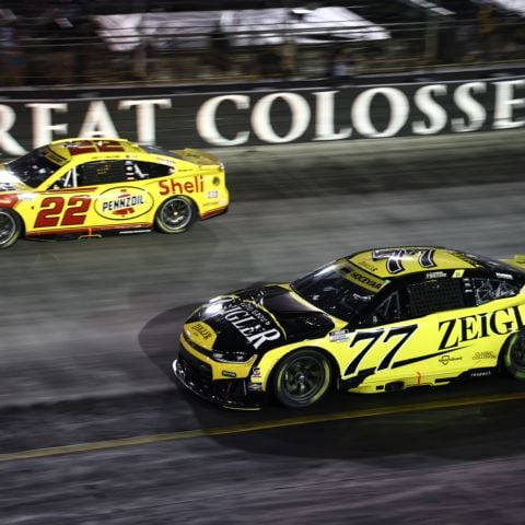 Joey Logano (22) and Carson Hocevar (77) battled on track for the Bass Pro Shops Night Race victory Saturday at Bristol Motor Speedway.