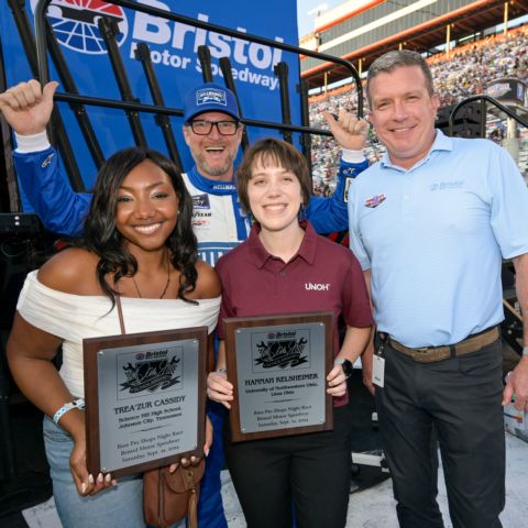 BMS Dale Jr. Scholarship winners Trea'zure Cassidy (left) and Hannah Kelsheimer (middle), were able to meet Dale Earnhardt Jr. (back) and BMS President Jerry Caldwell during pre-race ceremonies before the Food City 300.