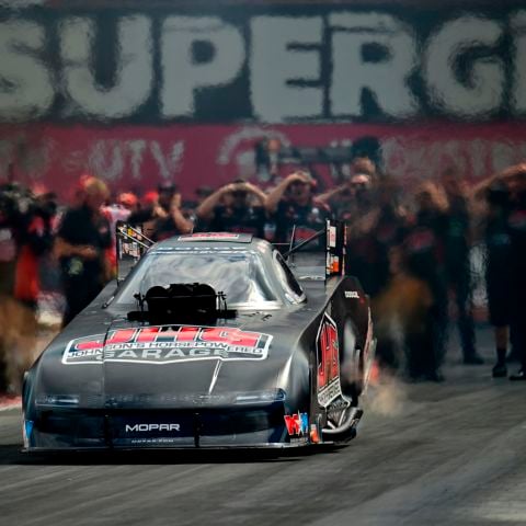 Matt Hagan powers his Dodge down the Bristol Dragway to take the Funny Car win at the Super Grip NHRA Thunder Valley Nationals.