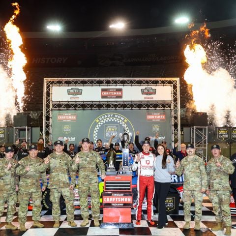 Members of the Tennessee Army National Guard celebrate with Christopher Bell Friday night after his victory at Bristol Motor Speedway.