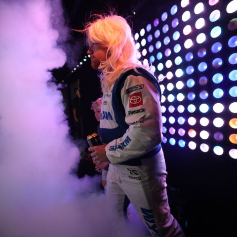 NASCAR Chase contender Tyler Reddick donned a wig and walked out to "9 to 5" by the late Dolly Parton, who was being honored at the track all weekend.