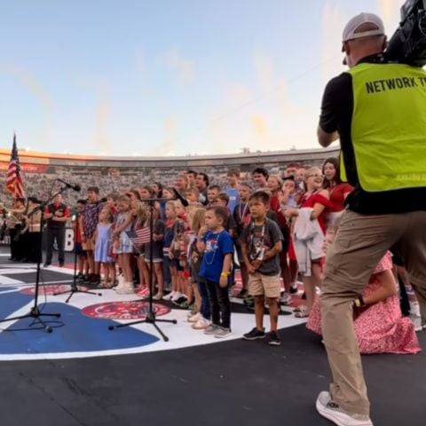 A tradition that began in 1999, the Motor Racing Outreach Children's Choir performs the National Anthem at the Bass Pro Shops Night Race.
