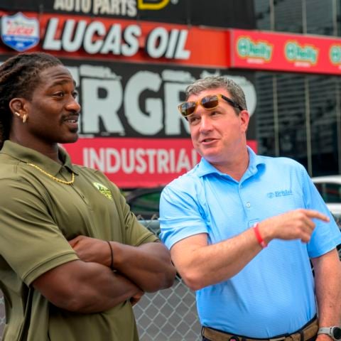 NHRA Celebrity Drag Challenge winner AJ Johnson (left) chats with Bristol Motor Speedway & Dragway President and General Manager Jerry Caldwell before the racing action begins.