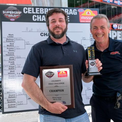 Hail to the victor: Matt Wilson of Team SuperGrip presented his plaque and trophy by NHRA Top Fuel superstar Clay Millican.