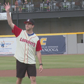 Smith waves to the crowd after throwing a pitch that landed in the catcher's mitt.