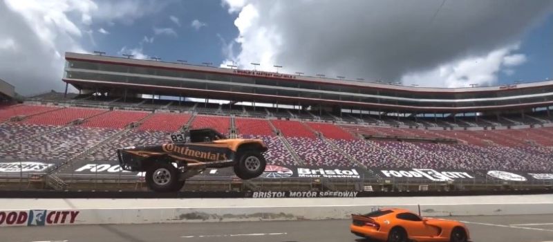 Cleetus McFarland put on an exhibition for the media recently to preview the Cleetus & Cars event at BMS on Labor Day weekend, which included him jumping this sleek orange sports car in his Stadium Super Truck.