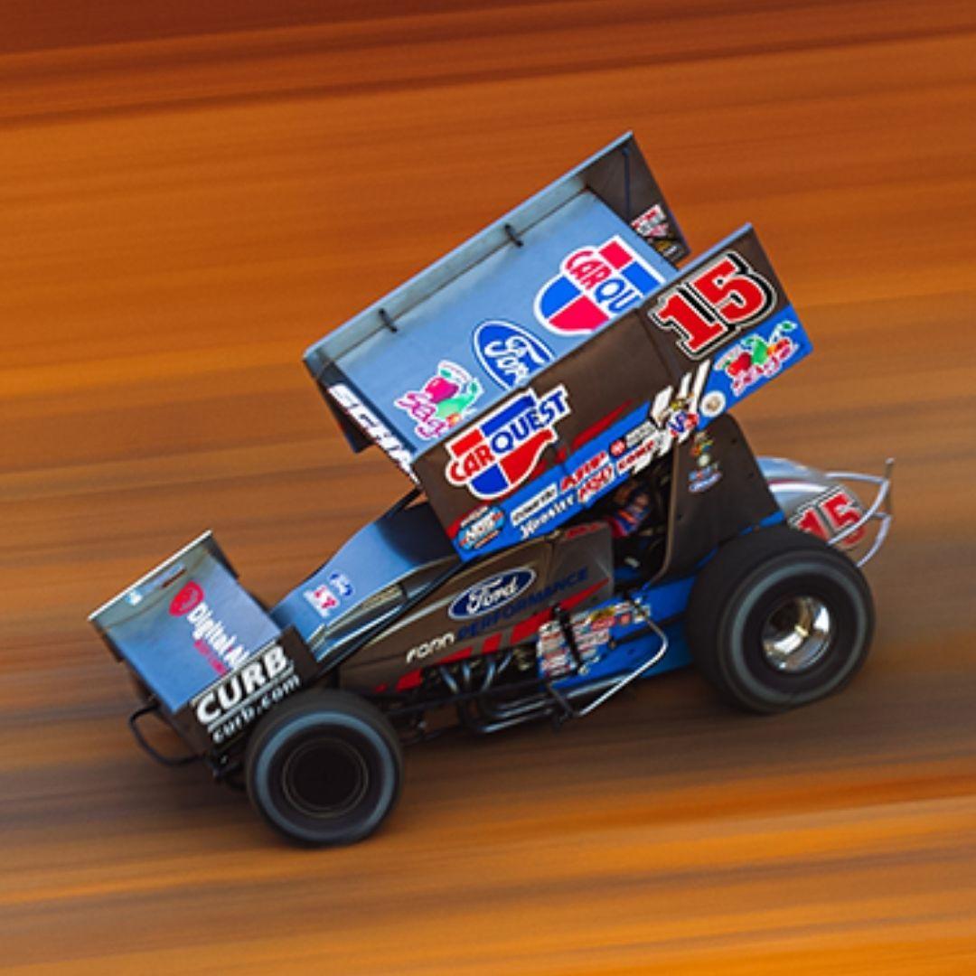 Sprint car driver Donny Schatz, right, of Fargo, N.D., battles for