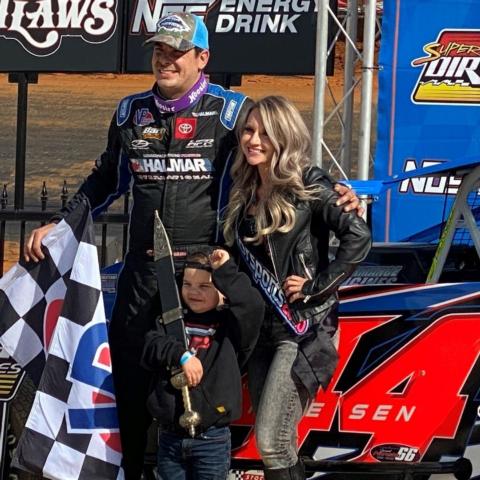 Stewart Friesen won Sunday's Super DIRTcar Series feature race. He is joined in BMS Victory Lane by his wife Jessica and son Parker.