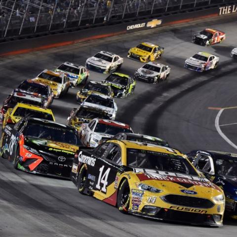 Clint Bowyer (14) led 120 laps of the 2018 Bass Pro Shops NRA Night Race that has been called an "Instant Classic" but finished sixth after Kurt Busch passed him for the lead late in the race. Bowyer finished second in 2017 and 2020 among his top finishes at one of his favorite tracks on the NASCAR Cup Series circuit. 