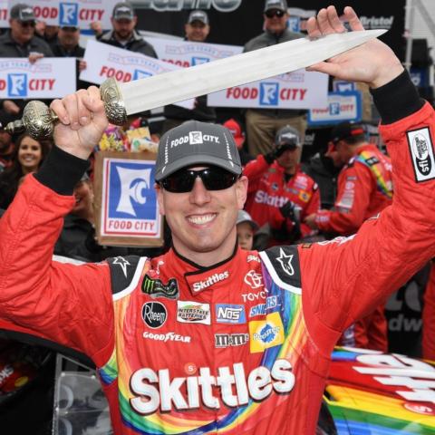 The BMS Gladiator Sword is 30 inches long with an imposing 19-inch hand-forged stainless-steel blade. It has a black leather scabbard and brass-plated sheath and handle. The official race name and date are engraved on the blade to connect each sword to its specific Bristol event. Here, Kyle Busch raises his sword in the air after winning the 2018 Food City 500.