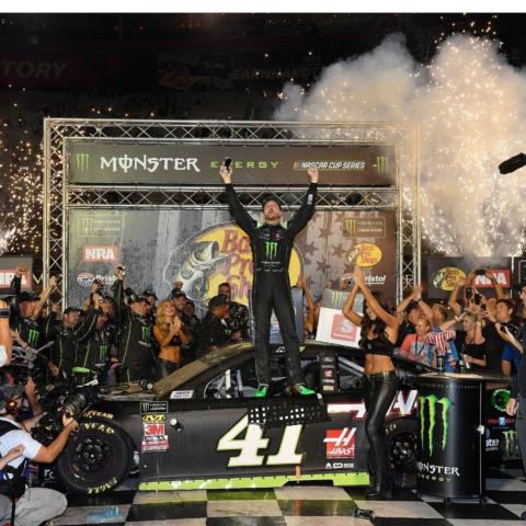 The unique BMS Victory Lane sits high up on the rooftop of one of the infield buildings. Here, Kurt Busch celebrates after winning the 2018 Night Race. 