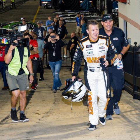 AJ Allmendinger walks to Victory Lane following his wild victory Friday night in the Food City 300.