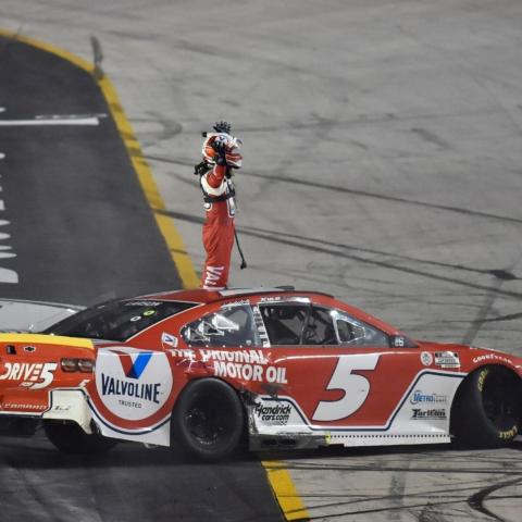 Kyle Larson salutes the crowd at Bristol Motor Speedway Saturday after holding off Kevin Harvick to win the Bass Pro Shops NRA Night Race.