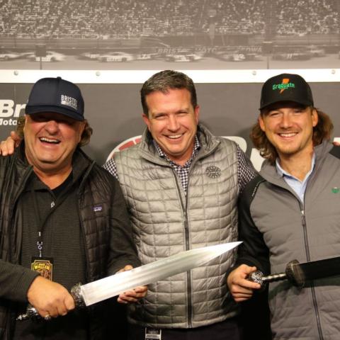 BMS GM Jerry Caldwell (center) presented Morgan Wallen (right) and Country Thunder CEO Troy Vollhoffer with their own signature BMS Gladiator Swords.