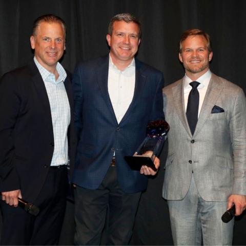 BMS executive vice president and general manager Jerry Caldwell (center) was recognized as the Speedway Motorsports Promoter of the Year during a company awards ceremony this week in Nashville. Speedway Motorsports president and CEO Marcus Smith (right) and Speedway Motorsports chief strategy officer Mike Burch (left) presented the award to Caldwell.