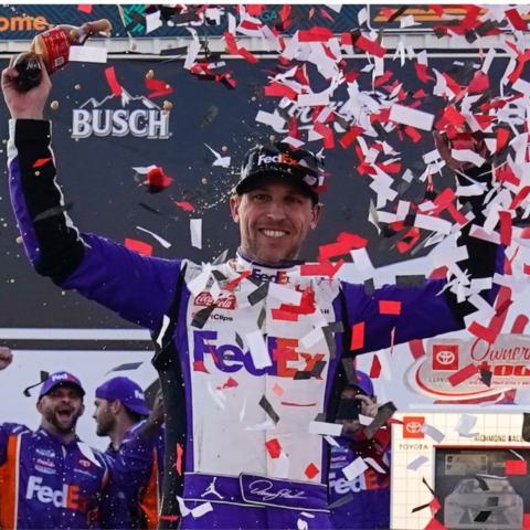 Denny Hamlin celebrates in Victory Lane after winning Sunday's NASCAR Cup Series race at Richmond Raceway in Virginia.