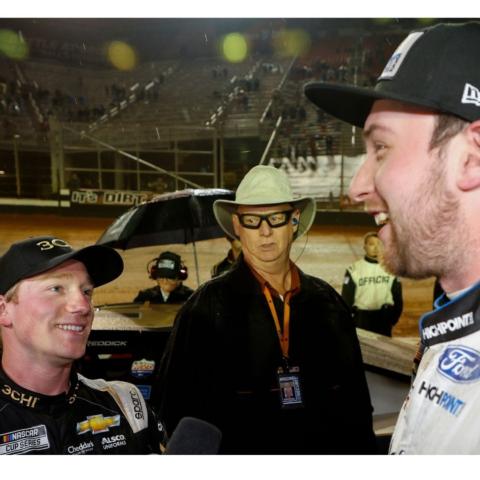 Tyler Reddick (left) and Chase Briscoe (right) had a discussion on pit road after on-track contact in turn three of the final lap of the Food City Dirt Race opened the door for Kyle Busch to take the checkered flag Sunday night at Bristol Motor Speedway.