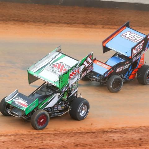 Veteran racer Kraig Kinser (11) says a driver is on the edge constantly during a high-speed lap around Bristol Motor Speedway in the World of Outlaws NOS Energy Drink Sprint Car Series.  