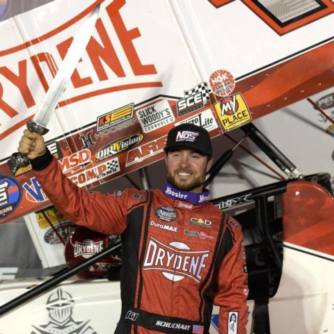 Logan Schuchart raises his BMS Gladiator Sword in Victory Lane Friday night after winning the $25,000 NOS Energy Drink Sprint Car Series feature in the World of Outlaws Bristol Bash at Bristol Motor Speedway. 