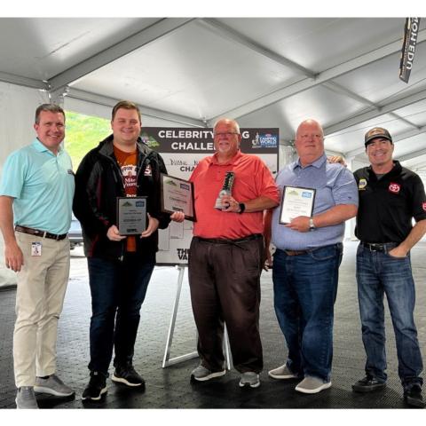 Bristol Motor Speedway/Dragway President Jerry Caldwell (left) congratulated the winners of the Thunder Valley Celebrity Drag Challenge, which included from left, runner-up Andrew McClung of WCYB TV, winner Duane Nelson of Holston Broadcasting, quickest reaction time winner Jud Teague of Visit Kingsport and NHRA Funny Car champ Ron Capps helped to coach all of the celebs during the event. 