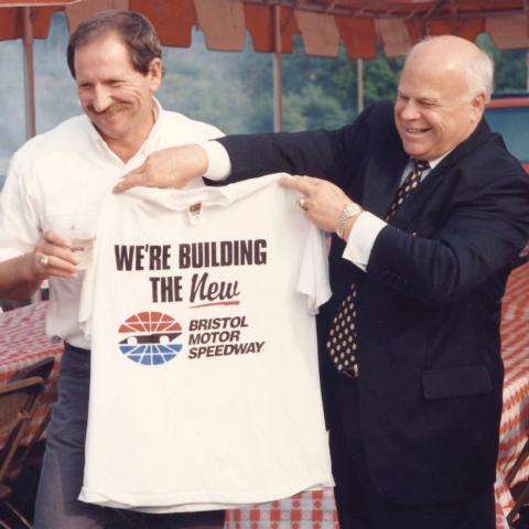 Bruton Smith's company, Speedway Motorsports, purchased Bristol Motor Speedway in 1996. In this iconic photo Smith shares a laugh with NASCAR legend Dale Earnhardt during the press conference to announce the purchase. 