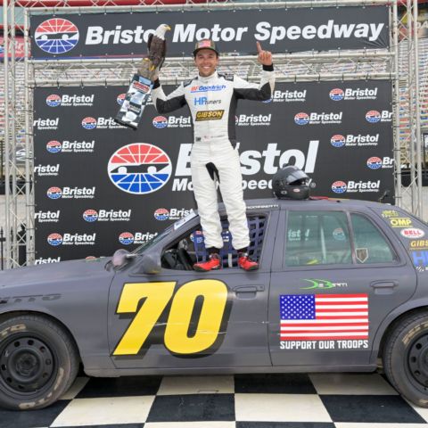 TV personality Brad DeBerti raced to the Bristol 1000 victory in his No. 70 Crown Vic sedan and celebrated in Bristol Motor Speedway's famed rooftop Victory Lane.