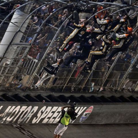 After winning Friday's Food City 300 Noah Gragson and his team climbed the frontstretch fence at Bristol Motor Speedway to celebrate.