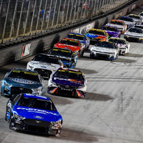 Chris Buescher (17) leads the Cup Series field into Turn 3 in the closing laps of the Bass Pro Shops Night Race Saturday at Bristol Motor Speedway.