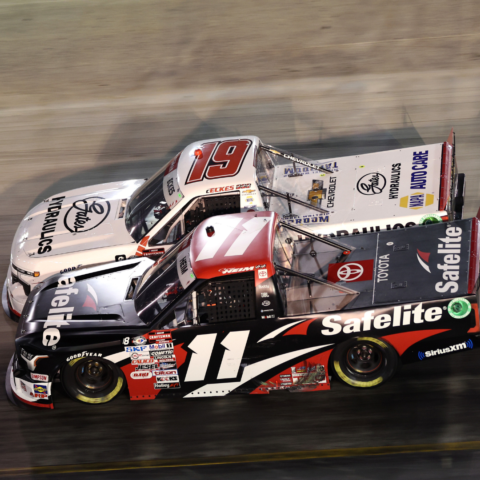 Corey Heim (11) pulled off a late race pass on leader Christian Eckes (19) to win Thursday night's UNOH 200 presented by Ohio Logistics at Bristol Motor Speedway.