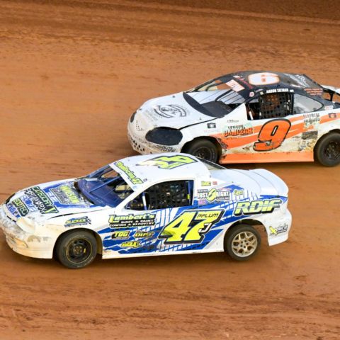 Brad Chandler (47) passed race long leader Aaron Tatman (9) on the final lap to take the thrilling victory in the Midwest Compacts feature race.
