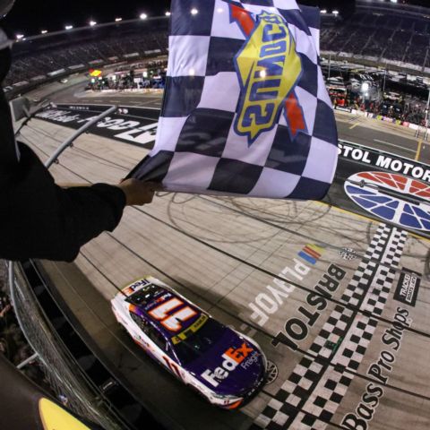 Denny Hamlin raced to victory in the Bass Pro Shops Night Race Saturday at Bristol Motor Speedway, punching his ticket to the Round of 12 Playoffs. It was Hamlin's third career win at America's Night Race.