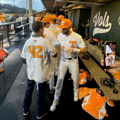 Rhodes met with players in the University of Tennessee dugout after throwing out the first pitch Wednesday to help promote the upcoming NASCAR weekend in Bristol, March 16-17.