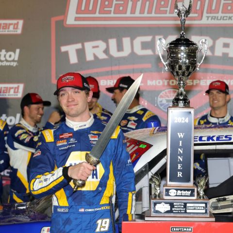 Christian Eckes shows off his hard ware in Bristol Motor Speedway's victory lane after winning the 250-lap WEATHER GUARD Truck Race Saturday night.