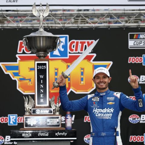 Larson scored Bristol trophies in Cup and Xfinity during the weekend. Here he poses with the Food City 500 trophy and sword.