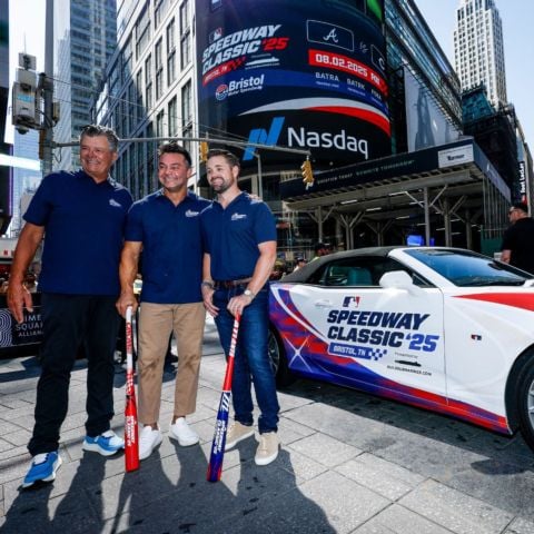 Stenhouse Jr., Swisher and Waltrip pose by the MLB Speedway Classic pace car in Times Square.