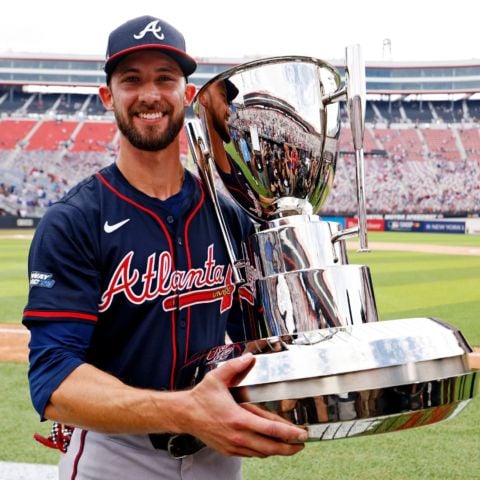 Eli White holds the MLB Speedway Classic trophy after his Atlanta Braves defeated the Cincinnati Reds Sunday at Bristol Motor Speedway. 