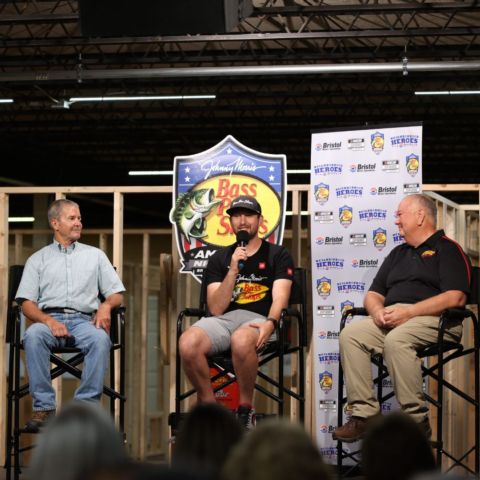 NASCAR superstar Chase Briscoe (center), along with retired NASCAR Cup driver Ward Burton, helped BMS officials name God's Pit Crew as a Neighborhood Hero.