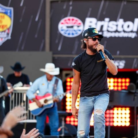 Grand Ole Opry member Chris Janson performs for the Bass Pro Shops Night Race crowd to get them revved up for the race.