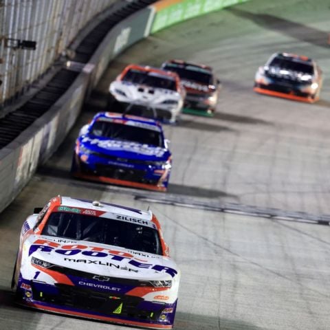 Connor Zilisch (1) leads the pack of O'Reilly Auto Parts Series cars Saturday night at Bristol.