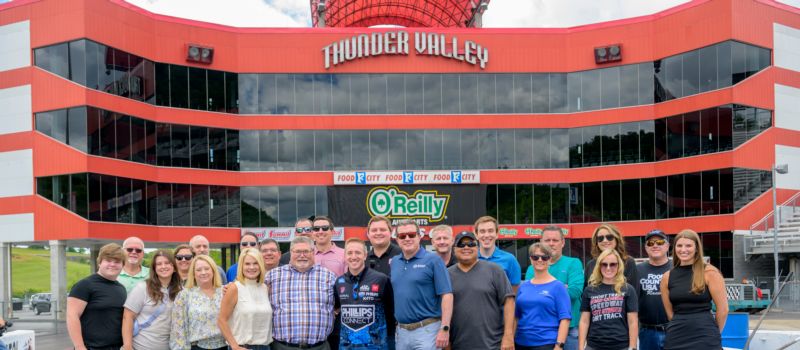 Bristol Dragway President Jerry Caldwell and NHRA Top Fuel driver Justin Ashley (center, front row) are surrounded by 20-plus local celebrities who competed in the Thunder Valley Celebrity Drag Challenge on Wednesday at Bristol Dragway.