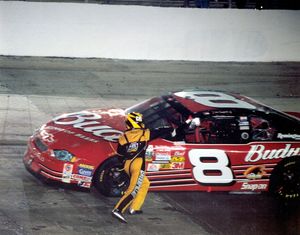In a moment of frustration, Ward Burton throws his heat shields at Dale Earnhardt Jr.'s No. 8 Chevy after the two made contact on track in the 2002 Night Race. 
